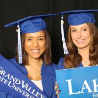 GradFest photobooth two friends with props
